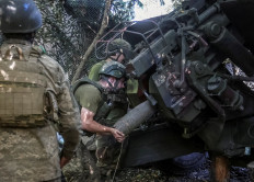Servicemen of the 67th Mechanized Brigade of the Armed Forces of Ukraine load a shell into an artillerty toward Russian troops on Aug. 30 amid Russia's attack on Ukraine at a position near the frontline town of Kramatorsk in Donetsk, Ukraine.