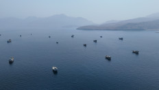A drone view shows vessels near the Strait of Hormuz, as seen from Musandam, Oman, Aug. 28, 2026.