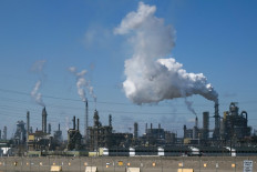 Smoke drifts from an oil refinery on May 5, 2026, from a Syncrude joint venture site in Alberta's Wood Buffalo, Canada.