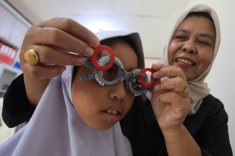 Early detection: A student takes a free eye examination on Aug. 29, 2026, during a social service event to detect vision problems early at the SLB Negeri Meulaboh special education school in Johan Pahlawan district, West Aceh, Aceh.