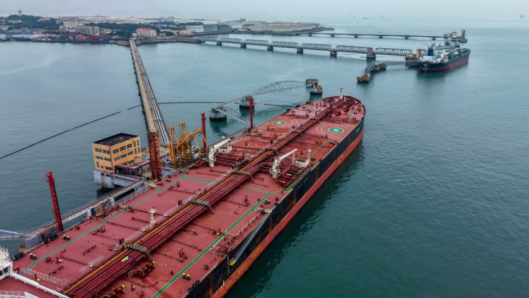 Oil tankers unload imported crude oil at the at the crude oil terminal of in Qingdao port, in China&rsquo;s eastern Shandong province on July 16, 2026.