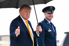 US President Donald Trump gestures as he walks to board Air Force One on Sept. 4, 2026, at Joint Base Andrews, Maryland. President Trump was traveling to New Jersey for the Labor Day holiday weekend.