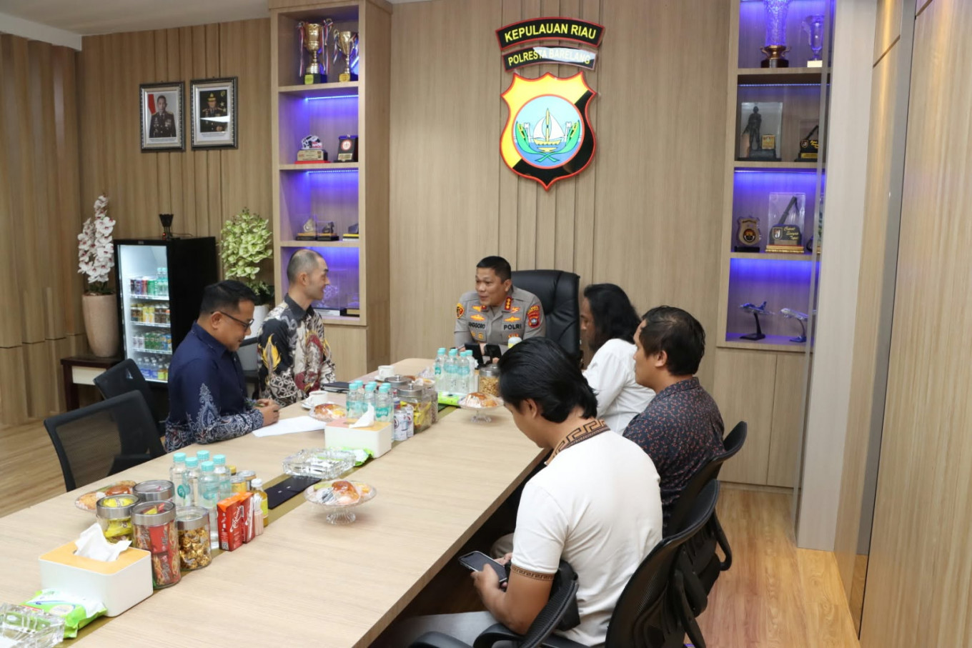 Batam Rempang and Galang (Barelang) City Police chief Sr. Comr. Anggoro Wicaksono (center) talks with Japanese Consulate General in Medan's security consul Komada Takayasu (second left) and staffer Ahmad Hanafi during a courtesy call on Friday, Sept. 4, 2026, at Barelang City Police headquarters in Batam, Riau Islands. The meeting was aimed as a silaturahmi (goodwill visit) to get the latest information on the public order situations in Batam city.