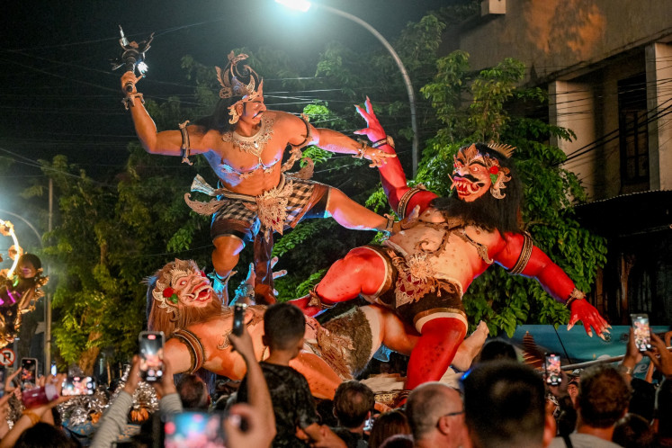 Balinese people carry an &ldquo;Ogoh-Ogoh&ldquo; effigy during a parade on the eve of &ldquo;Nyepi&ldquo; in Badung, Bali, on March 28, 2025. 