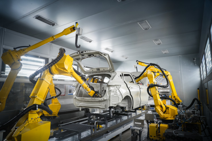 Paint is applied to a car under construction at BYD&rsquo;s first new energy vehicle manufacturing facility in the Subang Smartpolitan Industrial Estate, West Java.