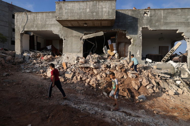 Palestinians inspect a family home on Sept. 8 destroyed by the Israel army following a military operation in the Israel-occupied West Bank village of Aqraba, south of the city of Nablus.