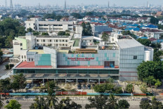 Anti-contagion bastion: The bright facade of the Sulianti Saroso Infectious Disease Hospital stands out on May 12, 2026 in Tanjung Priok, North Jakarta.
