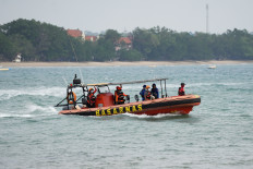 Search and rescue personnel ride on a rubber boat on Sept. 9 during a search operation for people who were reported missing in the waters of the Sunda Strait, including journalists covering the activity of Mount Anak Krakatau in Pandeglang, Banten.