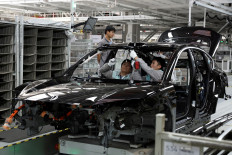 Employees work on the production line at a factory of Chinese electric vehicle (EV) maker Nio in Hefei, Anhui province, China, on April 2, 2025.