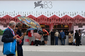 People walk in front of the Palazzo del Cinema during the 83rd International Venice Film Festival at Venice Lido, Venice, Italy on Sept. 10, 2026.