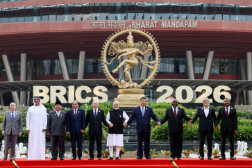 In this pool photograph distributed by the Russian state agency Sputnik, (left to right) Brazil's Foreign Minister Mauro Vieira, UAE's Supreme Council for National Security Secretary-General Ali Mohamed Hammad Al Shamsi, Indonesia's President Prabowo Subianto, Egypt's President Abdel Fattah al-Sisi, Russia's President Vladimir Putin, India's Prime Minister Narendra Modi, China's President Xi Jinping, South Africa's President Cyril Ramaphosa, Iran's President Masoud Pezeshkian and Ethiopia's Prime Minister Abiy Ahmed pose for a family photo during the 18th BRICS Summit in New Delhi. 