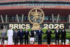 In this pool photograph distributed by the Russian state agency Sputnik, (left to right) Brazil's Foreign Minister Mauro Vieira, UAE's Supreme Council for National Security Secretary-General Ali Mohamed Hammad Al Shamsi, Indonesia's President Prabowo Subianto, Egypt's President Abdel Fattah al-Sisi, Russia's President Vladimir Putin, India's Prime Minister Narendra Modi, China's President Xi Jinping, South Africa's President Cyril Ramaphosa, Iran's President Masoud Pezeshkian and Ethiopia's Prime Minister Abiy Ahmed pose for a family photo during the 18th BRICS Summit in New Delhi. 