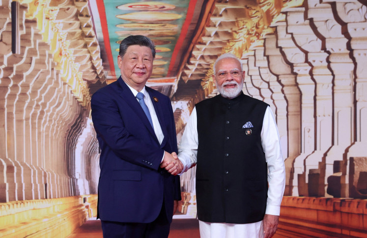 Warming ties: India&rsquo;s Prime Minister Narendra&nbsp;Modi&nbsp;shakes hands with Chinese President&nbsp;Xi&nbsp;Jinping&nbsp;on Saturday at Bharat Mandapam, the venue of the BRICS Summit in New Delhi.
