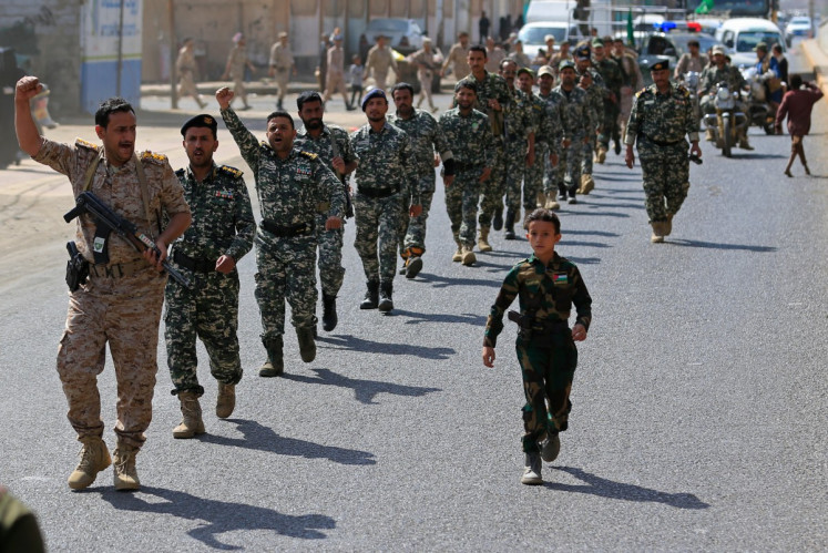 Fighters loyal to the Houthi authorities, march during a rally to recruit more fighters, in Sanaa on September 10, 2026. 
