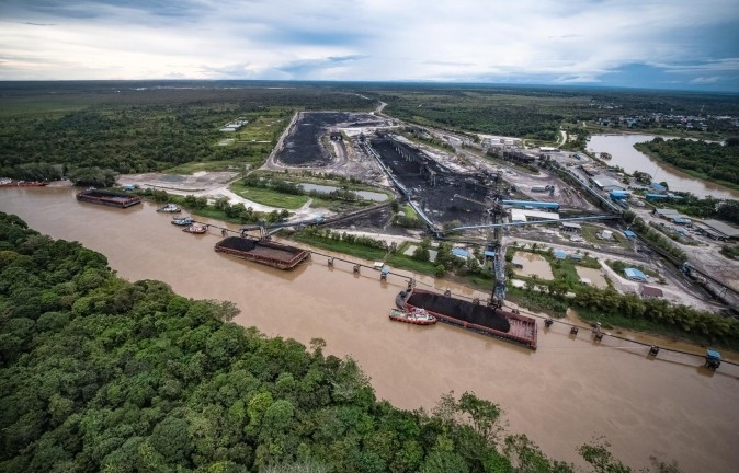 Coal is loaded onto barges at a jetty operated by the group along the Kedang Kepala River in Senyiur village, East Kutai regency, East Kalimantan, in this file photo.
