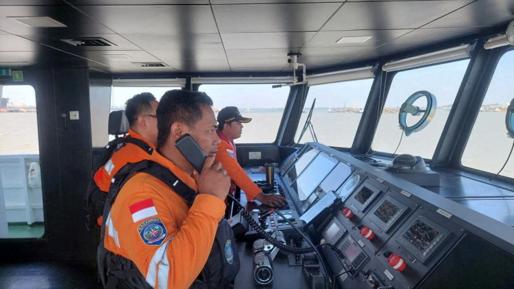 Rescuers work during a search operation after the Virgo Transport 8 ferry sank while sailing from Surabaya to Banjarmasin, in the Java Sea, September 13, 2026.