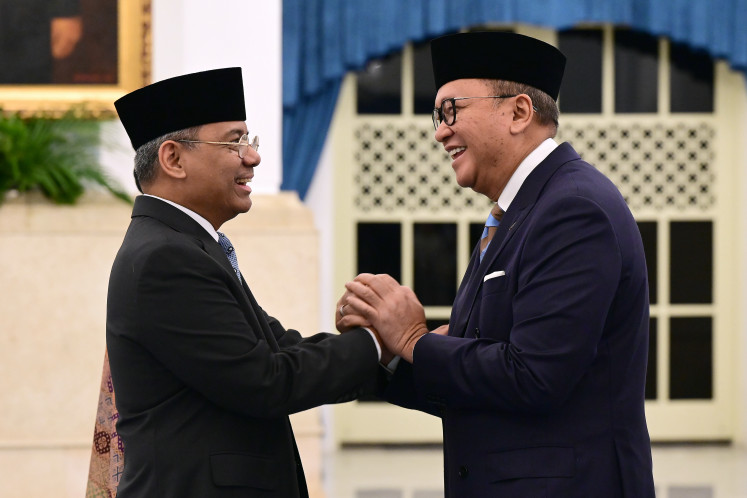 Newly appointed Finance Minister Suahasil Nazara (left) receives congratulations from Danantara Indonesia Chief Executive Officer Rosan Roeslani during a swearing-in ceremony on Sept. 14 at the Presidential Palace in Jakarta following a Cabinet reshuffle. President Prabowo Subianto appointed Nazara as finance minister for the remainder of the 2024&ndash;2029 term, replacing Purbaya Yudhi Sadewa.