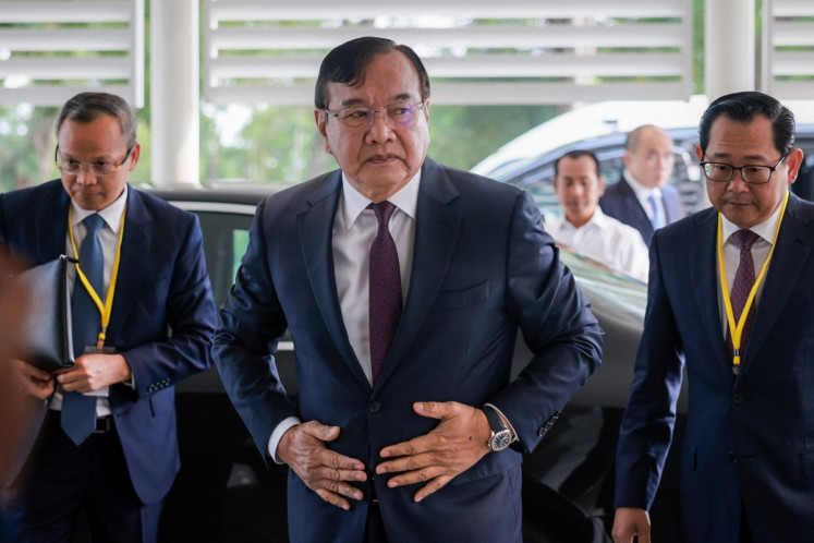 Cambodia Deputy Prime Minister and Minister of Foreign Affairs and International Cooperation Prak Sokhonn (center) arrives for the first meeting of the Conciliation Commission established under the United Nations Convention on the Law of the Sea (UNCLOS) in Singapore on September 15, 2026.
