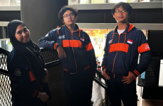 Indonesian students Alessander Reynard Aritonang, 19 (center), Rendy Dwi Nugraha, 20 (right) and Idam Sholikhah, 21, pose in this undated handout photo. The team will conduct a United Nations-supported microgravity experiment in Germany.