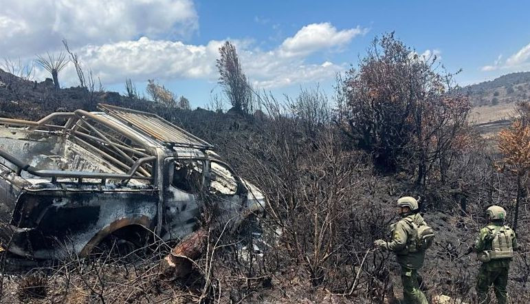 Officers of the Habema Joint Operations Command of the Indonesian Defense Forces (TNI) retrieve the body of a victim killed by Papuan separatists, on Wednesday near Lake Habema in Highland Papua.