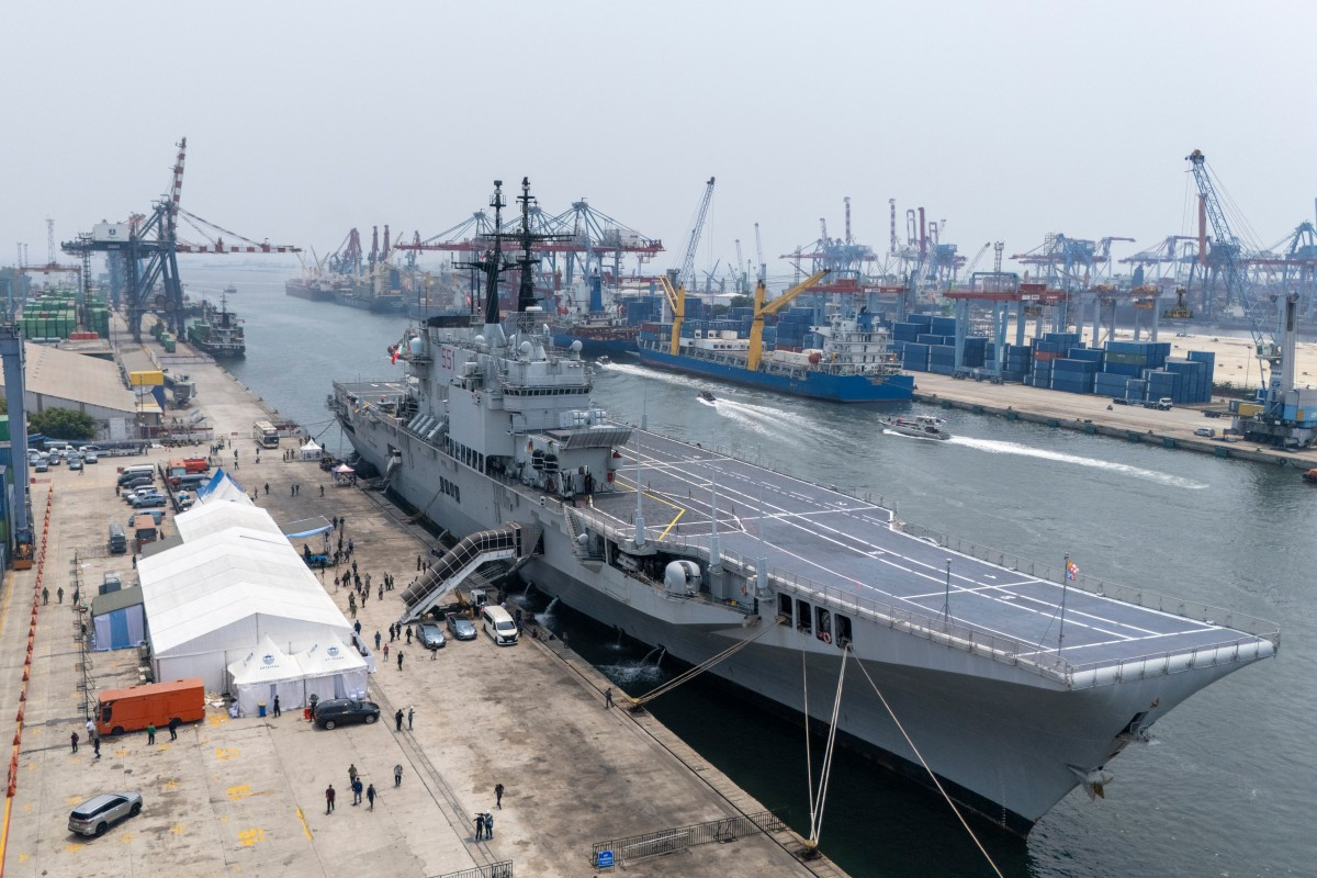 This aerial picture shows former Italian Navy aircraft carrier Giuseppe Garibaldi docked upon its arrival from Italy at Tanjung Priok port in Jakarta on September 18, 2026, ahead of its handover to the Indonesian Navy. 