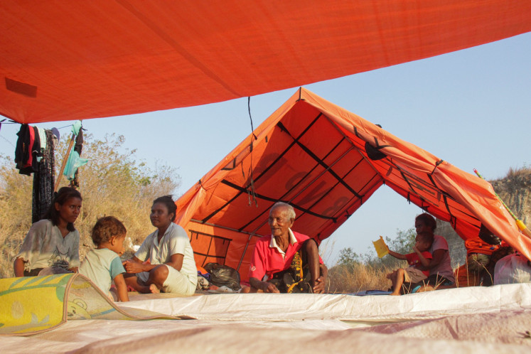 Several evacuees sit in an evacuation shelter on Aug. 28 in Lape, Aesesa district, Nagekeo regency, East Nusa Tenggara (NTT).