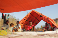 Several evacuees sit in an evacuation shelter on Aug. 28 in Lape, Aesesa district, Nagekeo regency, East Nusa Tenggara (NTT).