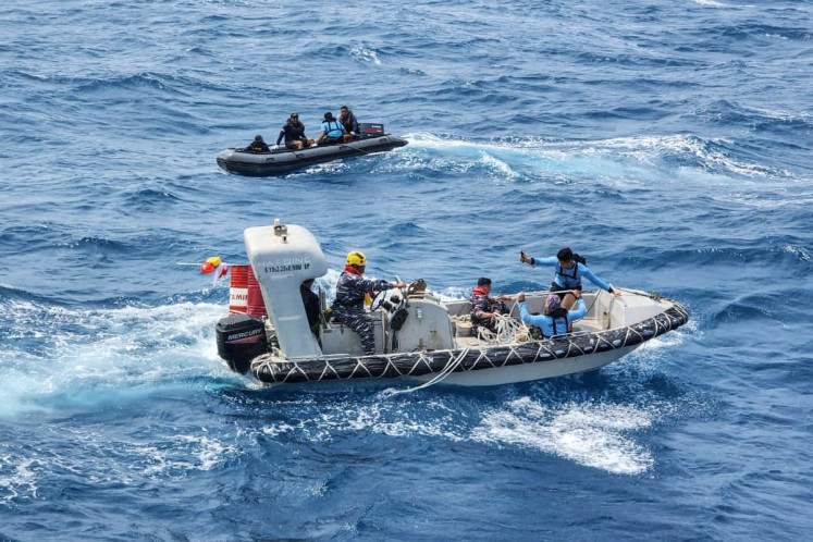 Indonesian Navy personnel maneuver their boats on Sept. 17, 2026 directly above the Virgo Transport 8 passenger ship which capsized in the Java Sea waters. The Virgo Transport 8 carried 213 passengers and 30 crew when it lost contact with its shipping company after departing from Surabaya, East Java to Banjarmasin, South Kalimantan on Sept. 13.