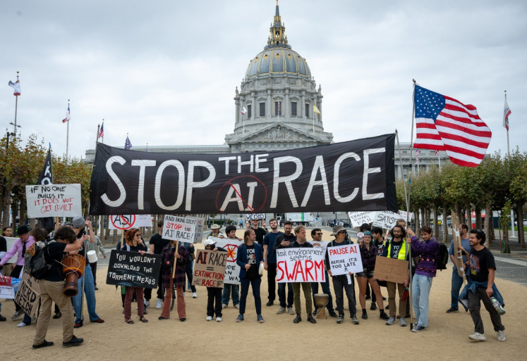 Protesters during a &ldquo;Stop the AI Race&ldquo; demonstration calling for a slowdown in the development of advanced artificial intelligence systems outside City Hall in San Francisco, California, on September 17, 2026. The world's biggest AI companies are working on creating a standards body, ChatGPT-maker OpenAI said on September 15, as fears rise about the dangers of AI and pressure is on to create a safer version of the technology. US President Donald Trump has dismissed warnings about the risks of AI as &ldquo;hoaxes&ldquo;.