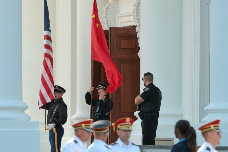 Members of a US military honor guard rehearse on Sept. 16, 2026 an arrival ceremony with a Chinese flag and US flag ahead of Chinese President Xi Jinping&rsquo;s state visit to meet US President Donald Trump at the White House in Washington, DC. 