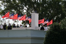 Members of the United States military honor guard carry US and Chinese flags on Saturday as they rehearse ahead of Chinese President Xi Jinping&rsquo;s upcoming visit to the White House in Washington, DC.