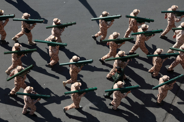 Members of Iranian militia forces (Basij) attend a military march in Tehran, Iran, September 18, 2026.