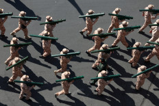 Members of Iranian militia forces (Basij) attend a military march in Tehran, Iran, September 18, 2026.