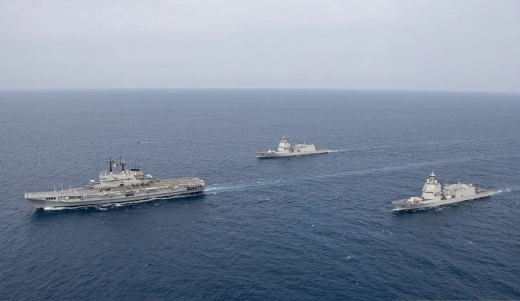 The newly acquired aircraft carrier Giuseppe Garibaldi (left), now KRI Sriwijaya, is accompanied by KRI Brawijaya (center) and KRI Prabu Siliwangi as they sail past Bangka waters on Sept. 17, 2026. 