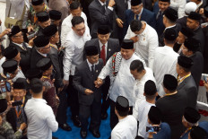 President Prabowo Subianto (fourth right) walks along Darussalam Gontor Modern Islamic boarding school leader Hasan Abdullah Sahal (fifth right) after a speech at Gontor&rsquo;s centennial celebration on Sept. 19 in Ponorogo, East Java.