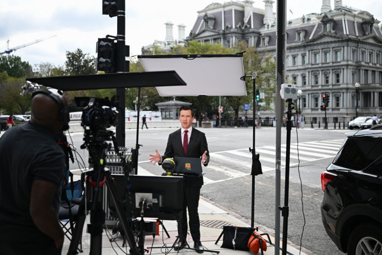 MS NOW White House Correspondent Vaughn Hillyard works on a street corner near the White House in Washington, DC, on September 21, 2026. Three leading US news outlets announced on September 21 they will go to court after being banned from the White House, as President Donald Trump claimed that media critical of his administration is a &ldquo;cancer&ldquo; threatening national security. CNN, MS NOW and Politico said in a joint statement that they were filing suit after Trump last week ordered them to be barred from the presidential complex.