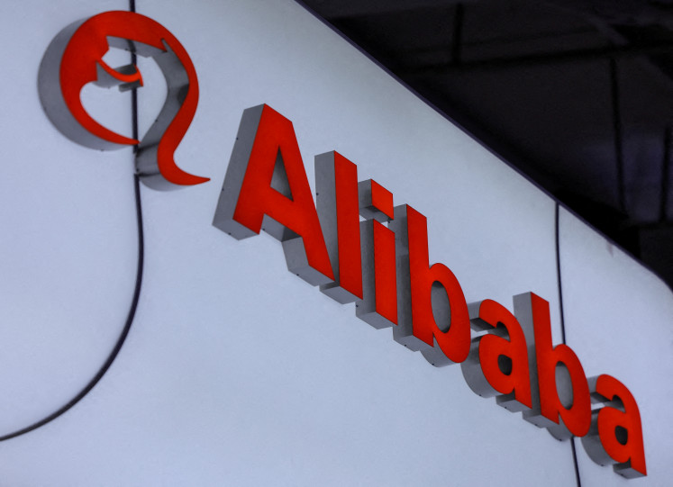 An&nbsp;Alibaba&nbsp;logo is displayed at the company's booth at the China International Fair for Trade in Services (CIFTIS) in Beijing on Sept. 10, 2025.