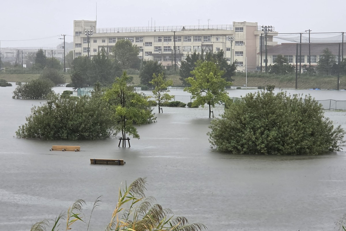Flooding inundates a park as heavy rain falls amid weather patterns due to Typhoon Dujuan in Ichikawa city, Chiba prefecture on September 21, 2026. Typhoon Dujuan forced the cancellation of at least 275 flights in Japan on September 21 and prompted warnings of potentially record-breaking rainfall as the storm nears Tokyo.