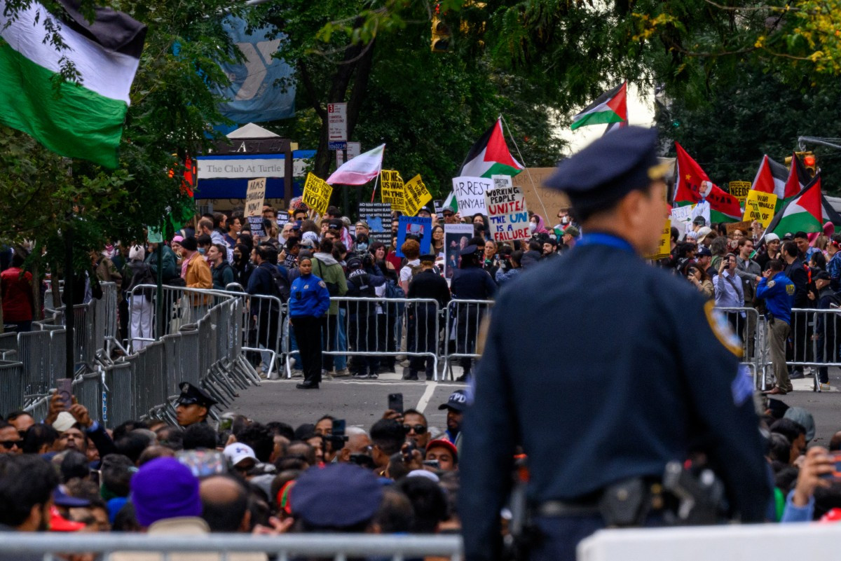 A pro-Palestinian protester carries a sign that reads, &ldquo;Arrest Netanyahu&ldquo; during a protest against Israeli Prime Minister Benjamin Netanyahu and the war in Gaza and Iran, which blocked the avenue next to the United Nations headquarters in New York City on Sept. 24, 2026. Netanyahu, wanted by the International Criminal Court, delivered an address at the annual UN General Assembly meeting, with many diplomats walking out in solidarity with the protesters outside.