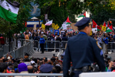A pro-Palestinian protester carries a sign that reads, &ldquo;Arrest Netanyahu&ldquo; during a protest against Israeli Prime Minister Benjamin Netanyahu and the war in Gaza and Iran, which blocked the avenue next to the United Nations headquarters in New York City on Sept. 24, 2026. Netanyahu, wanted by the International Criminal Court, delivered an address at the annual UN General Assembly meeting, with many diplomats walking out in solidarity with the protesters outside.