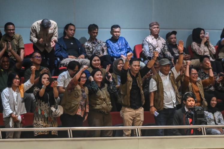 Common stand: Members of various civil society groups react in the public gallery as the House of Representatives passes the agrarian reform bill during a plenary session on Sept. 22, 2026 at the Senayan Legislative Complex in Central Jakarta.