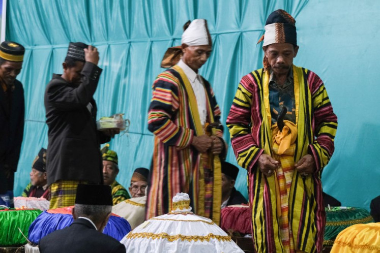 Treasured tradition: Customary leaders walk through a throng of revelers as they prepare to perform a ritual on Sept. 23, 2026, during the Cia-Cia community&rsquo;s annual Maataano Santa festival in Laburunci village, Buton regency, Southeast Sulawesi.

