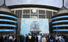 Fans arrive outside the Etihad Stadium ahead of the UEFA Champions League second leg semifinal soccer match between Manchester City and Real Madrid in Manchester, England, on May 17, 2023. Manchester City have been found guilty of all but one of 115 Premier League charges they face for breaching financial regulations, as reproted by 'The Athletic' reported on Sept. 25, 2026.