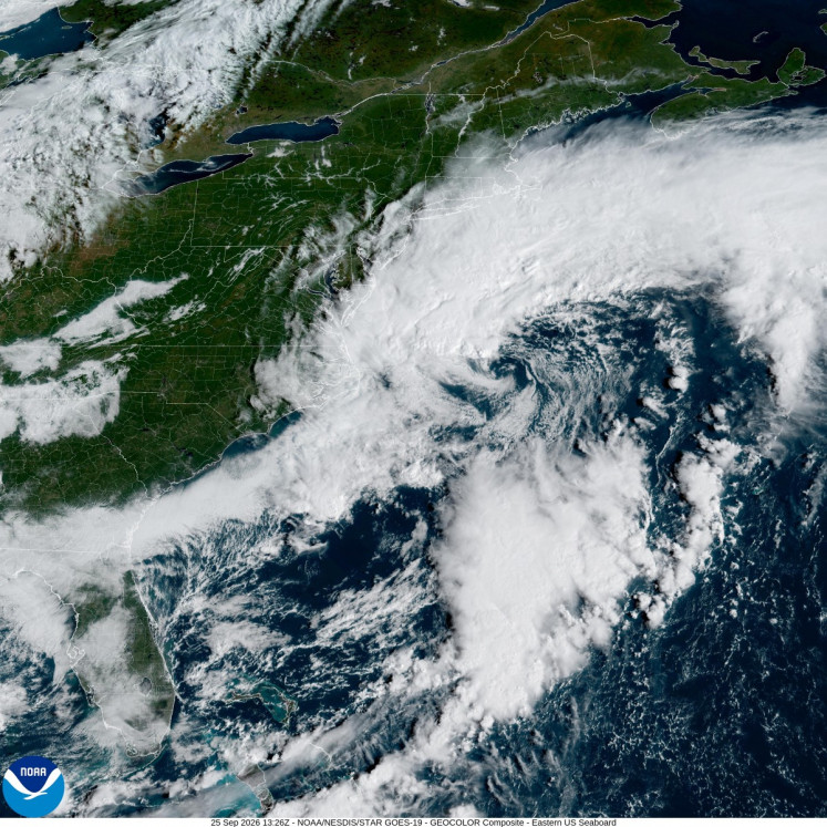 This handout satellite image obtained from the National Oceanic and Atmospheric Administration (NOAA) and their Geostationary Operational Environmental Satellites (GOES) shows a storm system over the Atlantic Ocean along the East Coast of the United States and Canada on September 25, 2026. The National Weather Service is warning of a nor'easter storm this weekend for the US East Coast, with potential for high winds, coastal flooding and heavy rain.