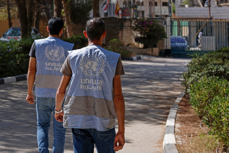 Employees walk toward the Qalandiya Vocational Training Centre run by the United Nations agency for Palestinian refugees, UNRWA, at Qalandiya in the Israeli-occupied West Bank on Aug. 4, 2026.