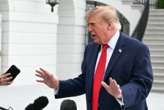 US President Donald Trump speaks to members of the press before boarding Marine One as he departs from the South Lawn of the White House in Washington, DC, on September 26, 2026. Trump is heading to Knoxville, Tennessee to attend the Tennessee/Texas college football game.