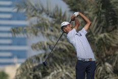 Randy Bintang of Indonesia plays a tee stroke on the No. 14 tee during the first round of the 2025 Asia-Pacific Amateur Championship being played at the Emirates Golf Club Majlis Course in Dubai, United Arab Emirates, on Oct. 23, 2025. 