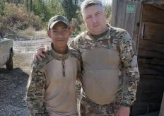Rendi Apriyanto, 30, an Indonesian national who was fighting for Russia in the war in Ukraine, poses in a military uniform with a man at an undisclosed location, in this undated photo. Rendi was reportedly killed in September in a drone attack.