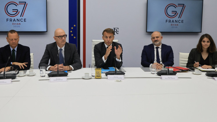 French President Emmanuel Macron (center) speaks next to French Presidential advisor Emmanuel Bonne (left), France's Economy, Finance and Industry Minister Roland Lescure, Secretary-General of the Office of the President of the French Republic Pierre-Andre Imbert and Camille Morfouace de Broucker following a video conference with G7 leaders from the Elysee Presidential Palace in Paris, France on Oct. 2, 2026. G7 leaders were holding talks on Oct. 2 to coordinate action on tackling high fuel prices, after Washington upped pressure on Europe to release its strategic reserves or face a US diesel export ban.