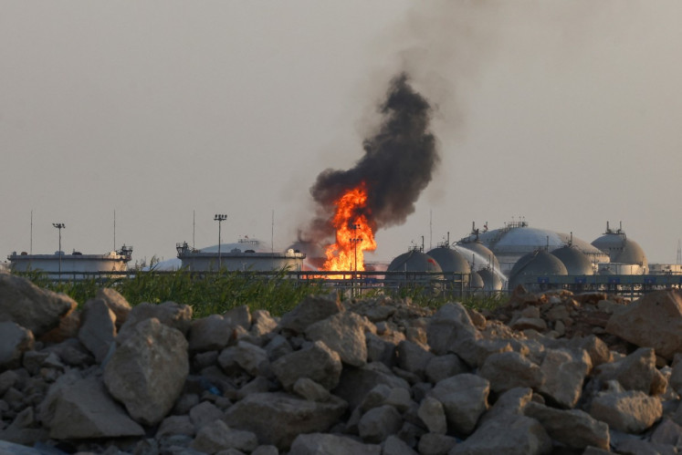 Flames burn at a facility belonging to Saudi oil giant Aramco south of Riyadh on October 3, 2026. The circumstances remained unclear but in recent weeks Aramco, majority-owned by the Saudi state, has come under attack from the Houthi authorities targeting the kingdom as part of the war in Yemen where Riyadh is backing the internationally recognized government. An AFP journalist reported seeing fire engines attempting to extinguish a blaze at the energy giant's Riyadh refinery, located south of the capital, while ambulances and police vehicles were stationed near the facility.